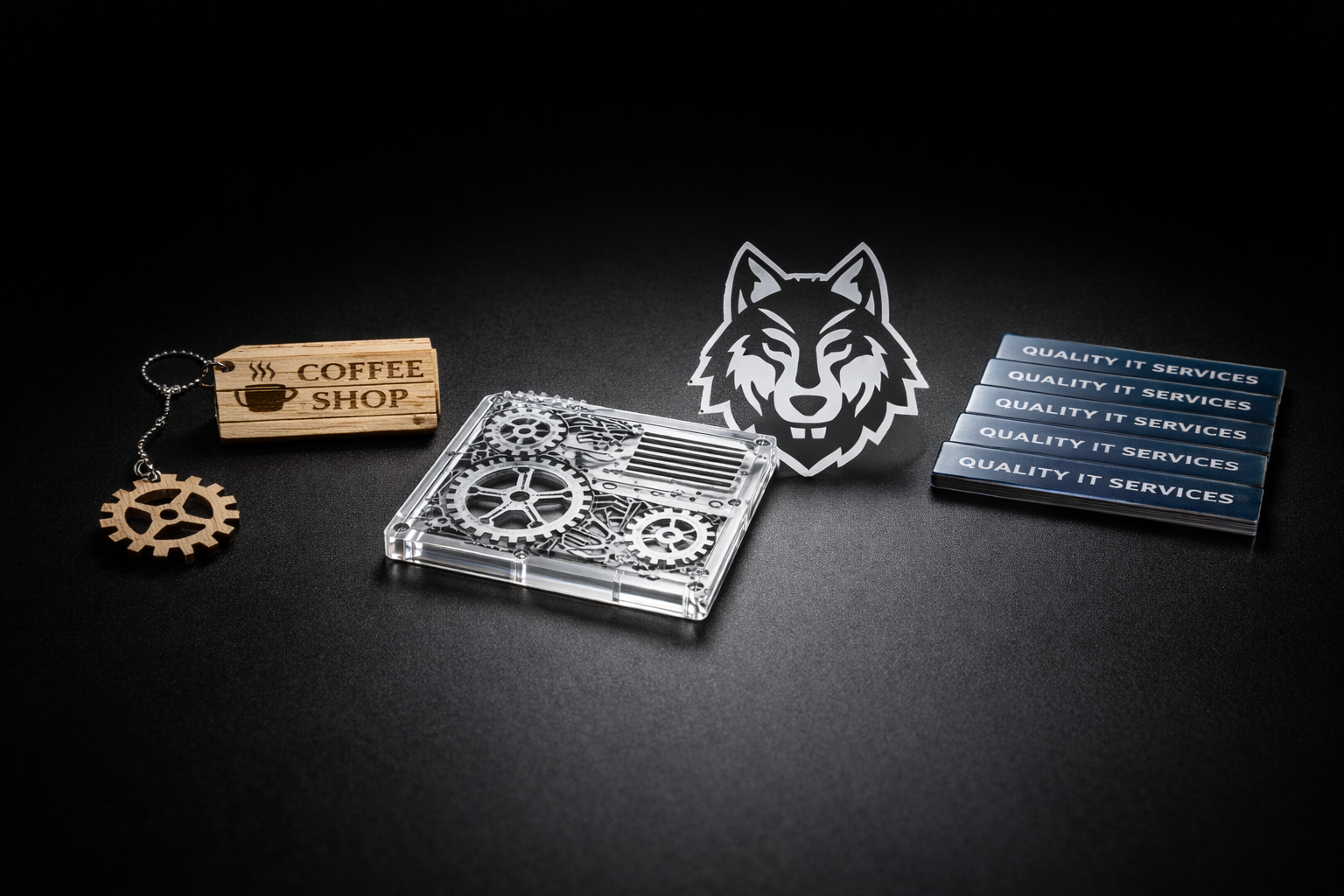 Laser cut and engraved products including keychains, gears, and business tags by Red Laser Studio